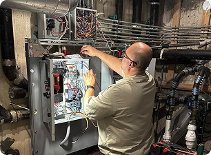 technician working on a electrical panel